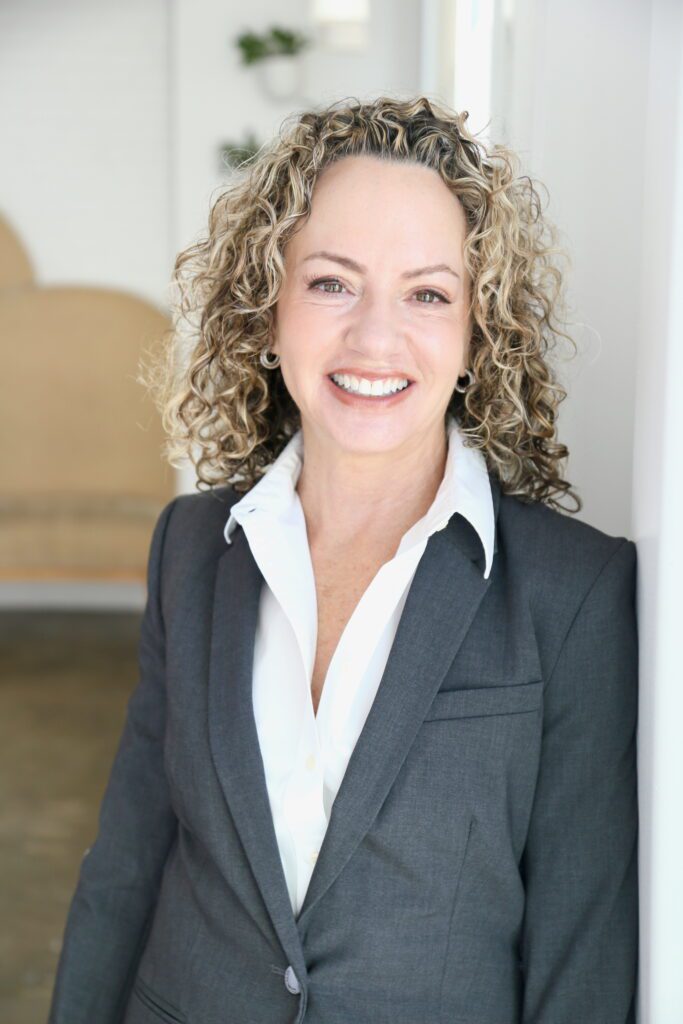Smiling businesswoman in gray suit