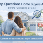 Couple embracing and viewing house with sold sign