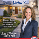 Smiling real estate agent in front of house
