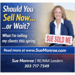 Smiling agent holding 'sold' sign, spring market tips