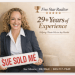 Smiling female realtor holding "sold" sign